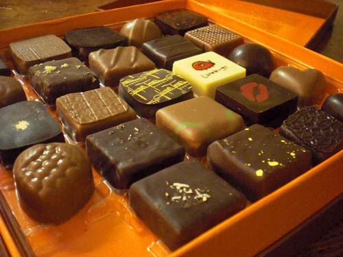 We cut Jacques Torres chocolates into pieces for all of us to share.